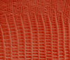swatch of orange reptile textured leather